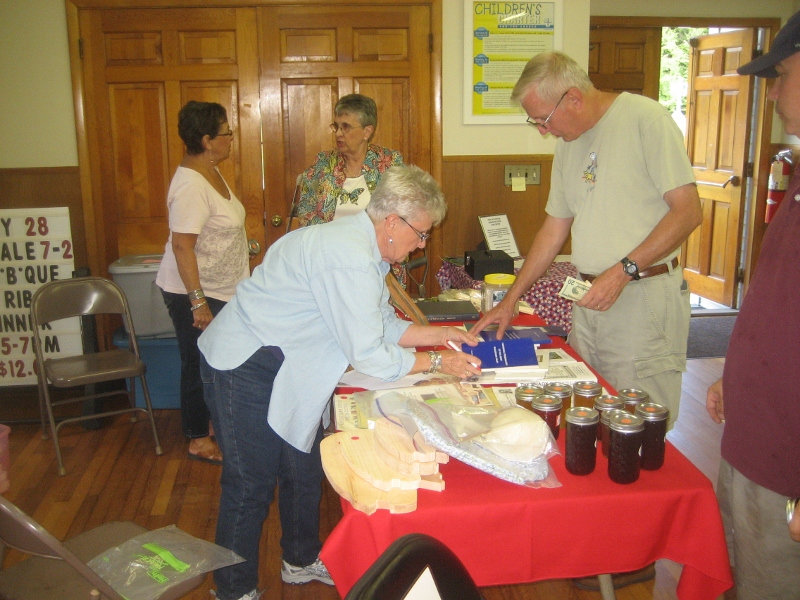17 Marcia selling a book, Jane in background 8-25-12 (800x600).jpg