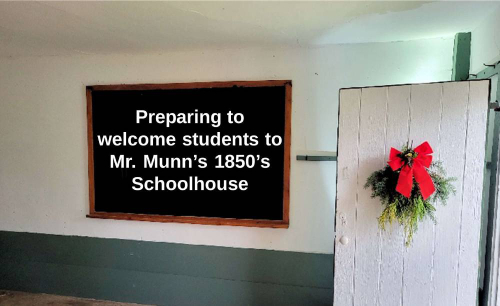 Preparing to welcome student to Mr. Munn’s 1850’s one-room schoolhouse